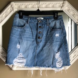 Button Fly destroyed denim skirt
